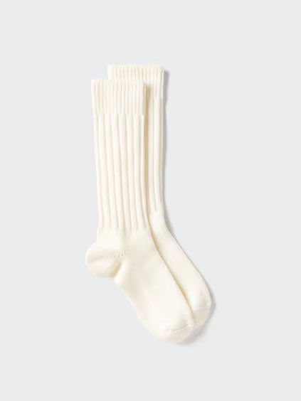 Cream sock on a light gray background